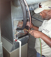 Technician Working on Heater - Air Conditioning Services Technician Working on Heater - Air Conditioning Services